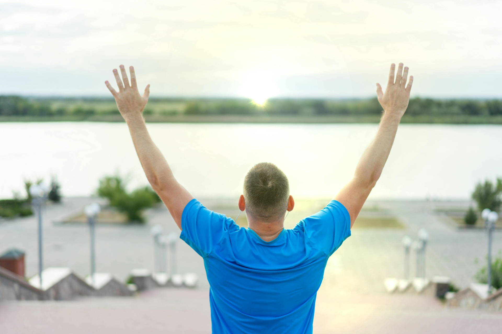 Arms raised in hope and freedom